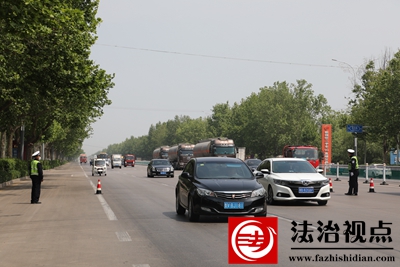 图四：严查交通违法，确保道路畅通.JPG